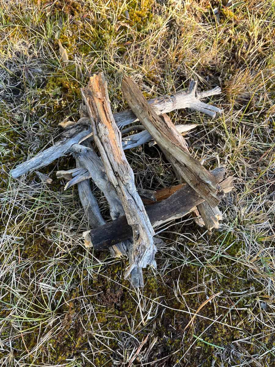 Firewood set up in a log cabin structure