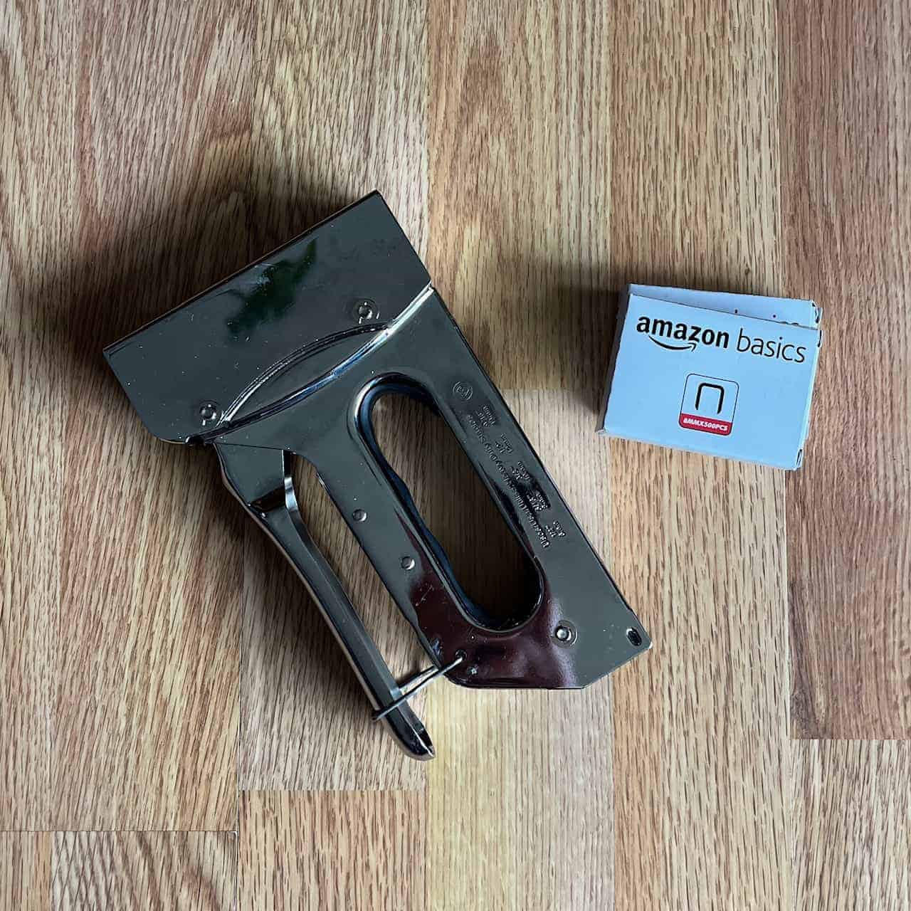 A stapler with a couple extra boxes of staples.