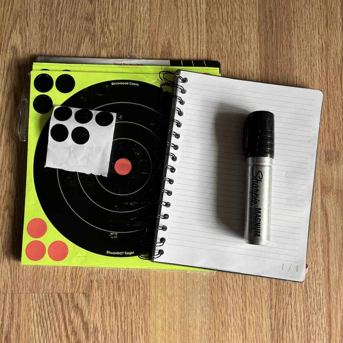 Shooting targets, a notebook, and a large Sharpie.